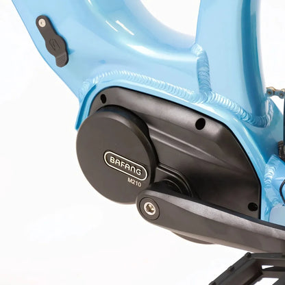 The product is an electric bike, model Econo Mare City EEC4LK. The image shows the Bafang M210 drive unit, which is mounted on the bike's frame. The frame color is blue, giving the bike a modern and attractive look. The bike is designed for city riding, making it suitable for everyday use in an urban environment.
