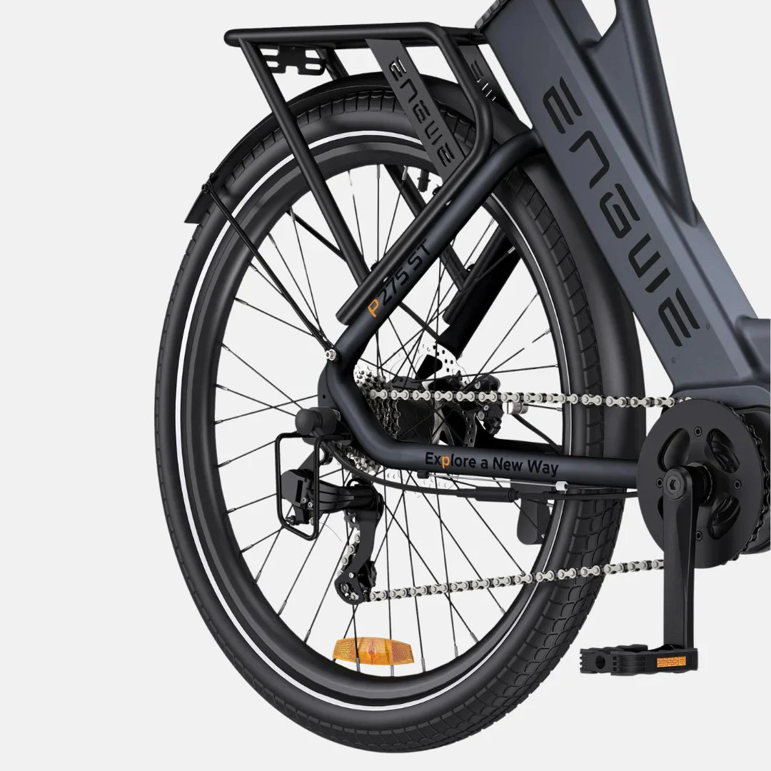 The image shows an Electric bike by Engwe, model P275 ST. The rear of the bike is visible, including the frame, chain, derailleur, and pedals. The bike has a robust construction and is equipped with wide tires and a rack for accessories. The frame features the inscription "Explore a New Way," suggesting a purpose of exploration and active leisure.