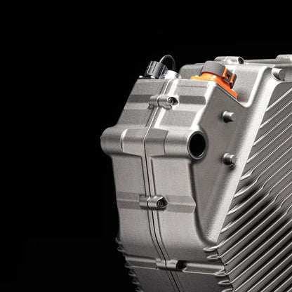 Close-up shot of the motor housing of the Stark Varg electric motocross bike on a black background.