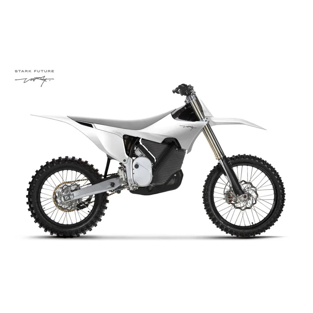 Side view of the Stark Varg electric motocross bike, showcasing its sleek design and tires.