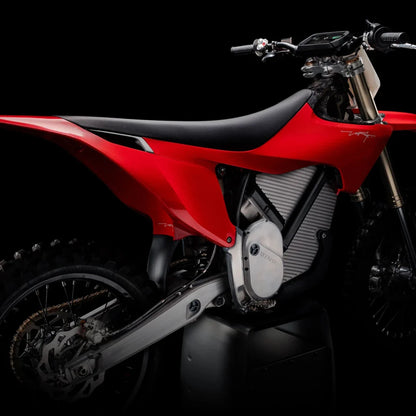 Electric Motocross Motorcycle Stark Varg in Stunning Red on a Black Background.