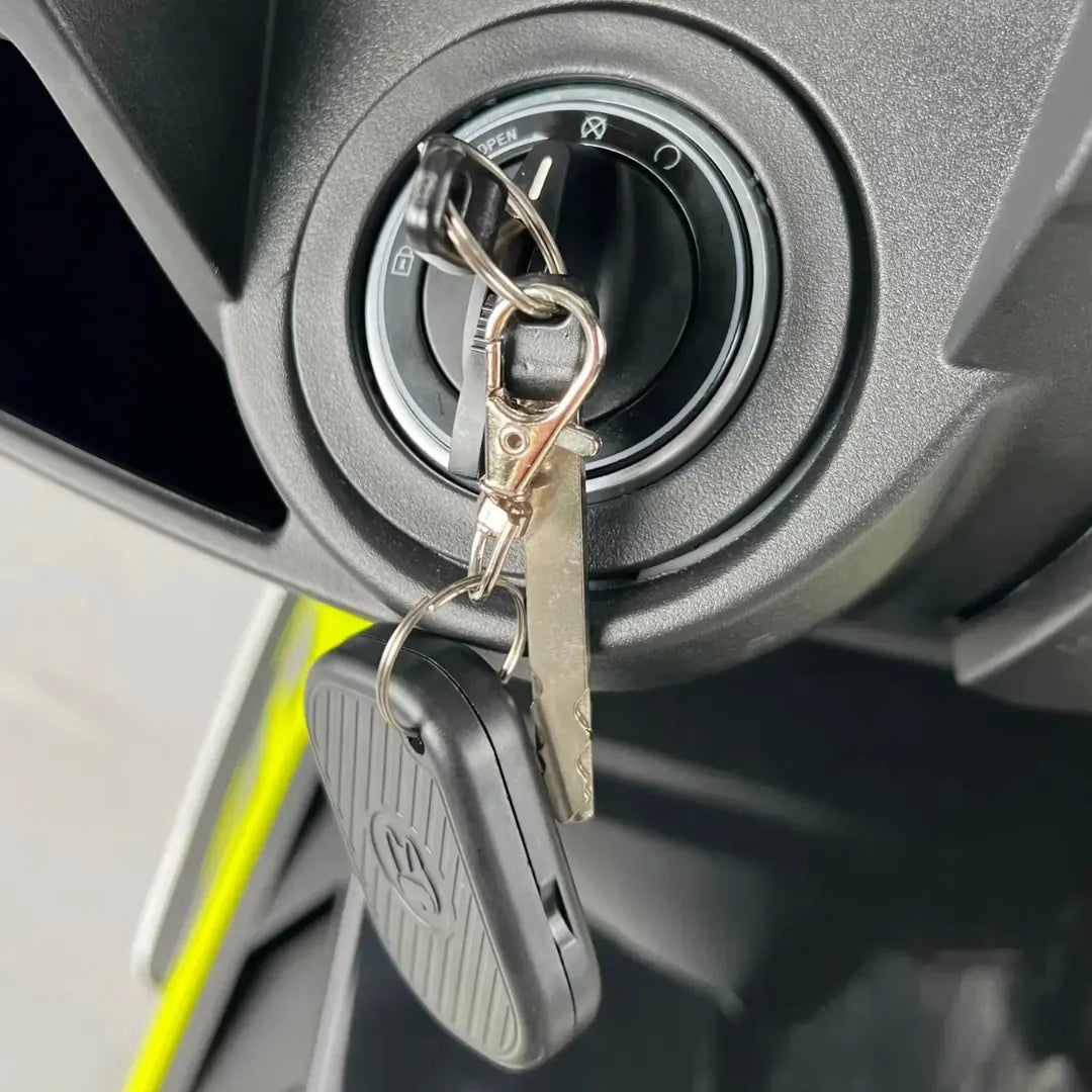 Close-up shot of the ignition key and keychain for the Electric Motorcycle Felo Fw 06.
