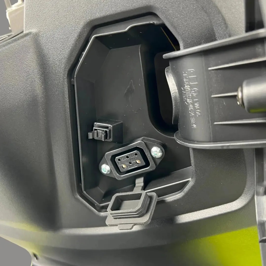 A close-up view of the charging port on the Felo Fw 06 electric motorcycle.