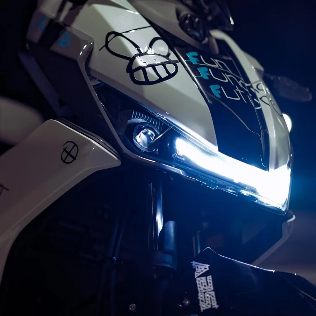 A close-up shot of the Electric motorcycle Felo Fw 06, showcasing its sleek design and LED headlights.