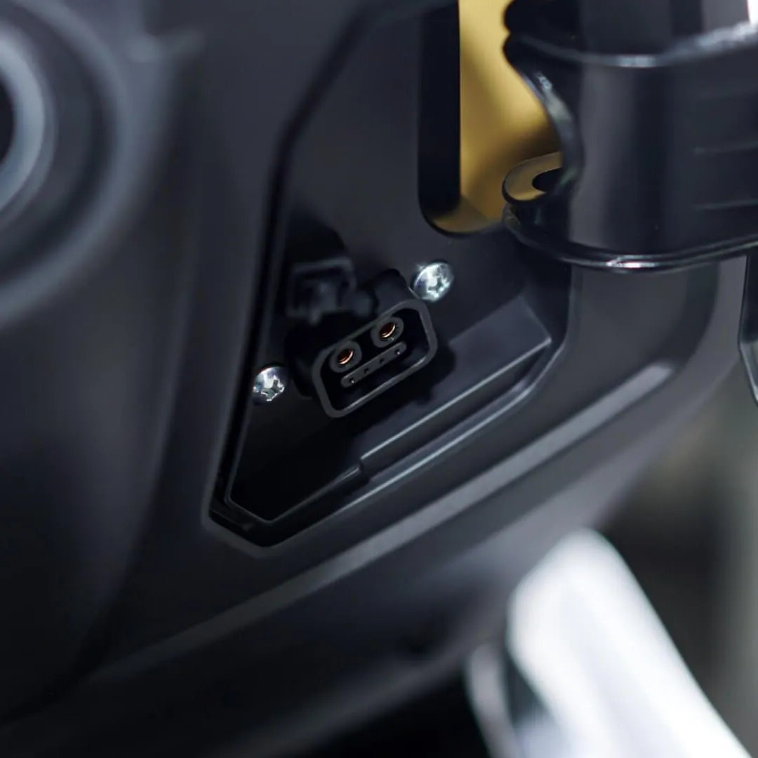 Close-up shot of the charging port on the Felo FW 06 Electric motorcycle.