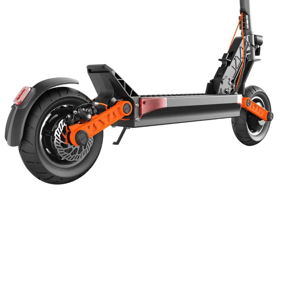 The product is an electric scooter, brand Joyor, model S10-S. The image shows the rear part of the scooter, which includes a wide rear wheel, brakes, and part of the frame in black with orange details. The structure supporting the wheel and a reflective light on the rear are also visible.