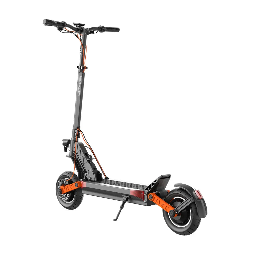 The product is an Electric Scooter, brand Joyor, model S10. The image shows the scooter in black and orange, with ergonomic handlebars, a wide footboard, and large wheels. The rear light and kickstand mount are also visible, indicating practicality and usability during rides.