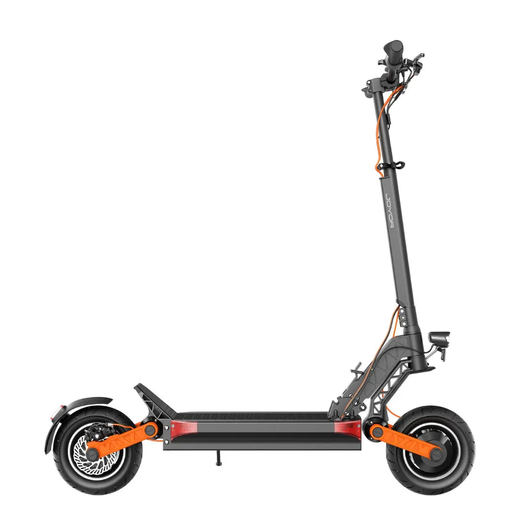 The product is an Electric Scooter, brand Joyor, model S10-S-Z. The image shows the scooter from a side perspective, featuring a robust construction, a wide footboard, and large wheels. The color combination includes black and orange, giving the scooter a dynamic look. The handlebars and some mechanisms are also visible, indicating functionality and comfort during the ride.
