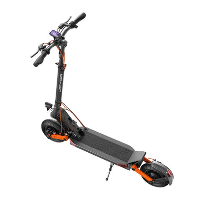 The product is an Electric Scooter, brand Joyor, model S10 S-Z. The image shows a scooter with a robust frame, a wide deck for standing, and handlebars that include a display for information. Large tires and a braking system are also visible, indicating a comfortable and safe ride. The color combination includes black and orange, giving the scooter a sporty appearance.