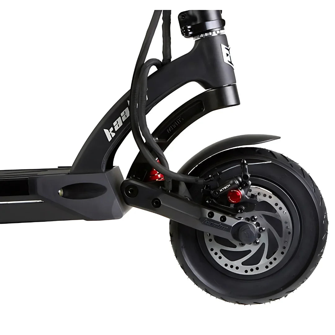 The image shows an Electric Scooter, model Kaabo Mantis 10 Plus. The rear wheel unit with a disc brake system, featuring a red detail, is visible. The wheel has a wide tire, providing better stability and grip. The Kaabo brand name is clearly visible on the scooter's frame, emphasizing the product's quality and reliability.