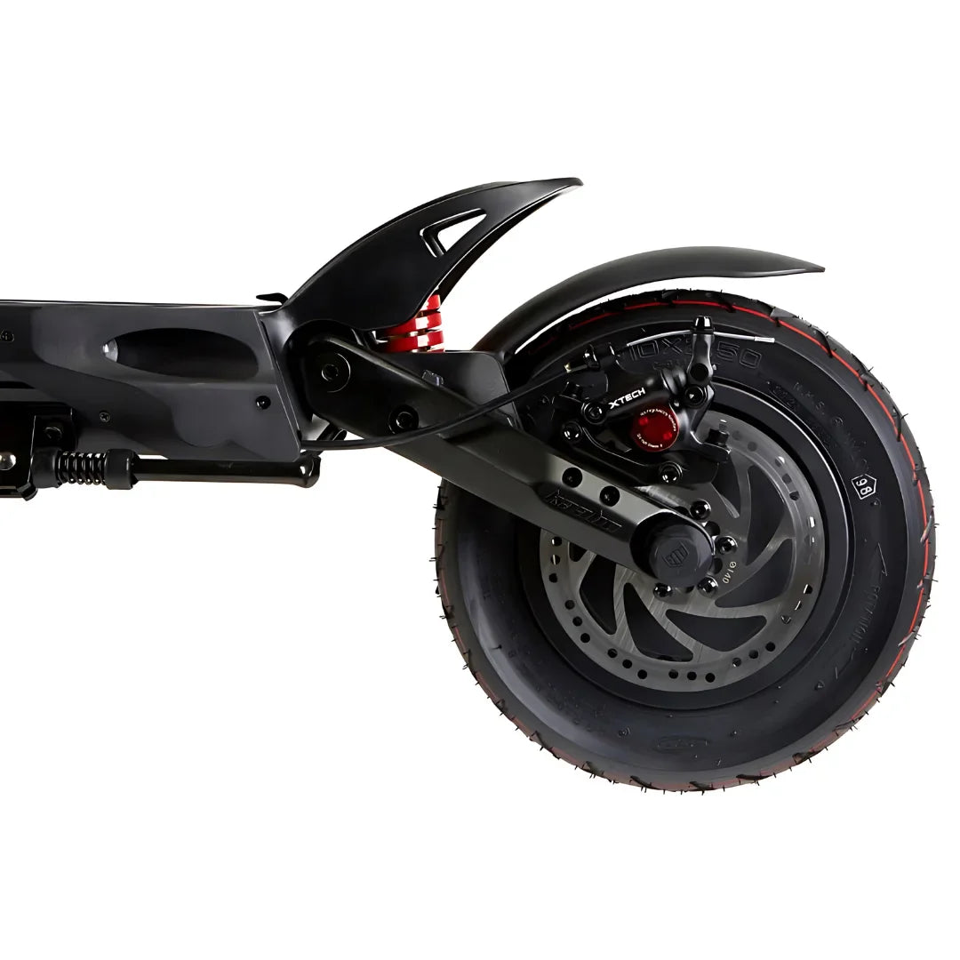 The product in the image is an Electric Scooter, model Kaabo Mantis 10 Plus. The image shows the rear part of the scooter, including the rear wheel, suspension, and brakes. The wheel has a wide tire with a pronounced tread, indicating good grip, while the suspension is designed for a comfortable ride on various surfaces.