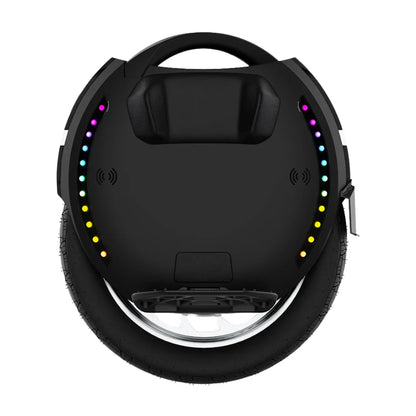 The product pictured is an electric unicycle, brand KingSong, model 18L. The image shows the upper part of the unicycle, which has an ergonomic design and a handle for easy carrying. Colored LED lights are visible along the edge of the device, adding an aesthetic element and increasing visibility. The wheel is wide and robust, allowing for stable riding.