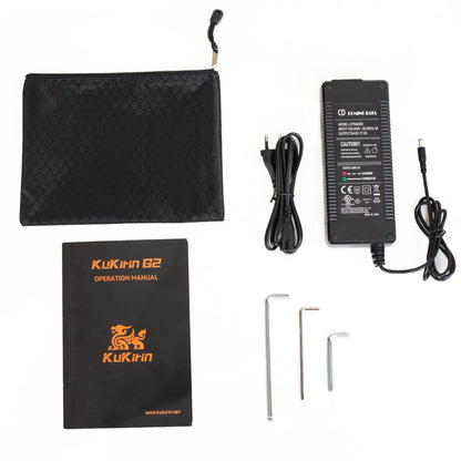 The product pictured is the Electric Scooter KuKirin G2. The image displays various accessories, including a power adapter, charging cable, pouch, user manual, and three assembly keys. All components are arranged on a white background for clear visibility.