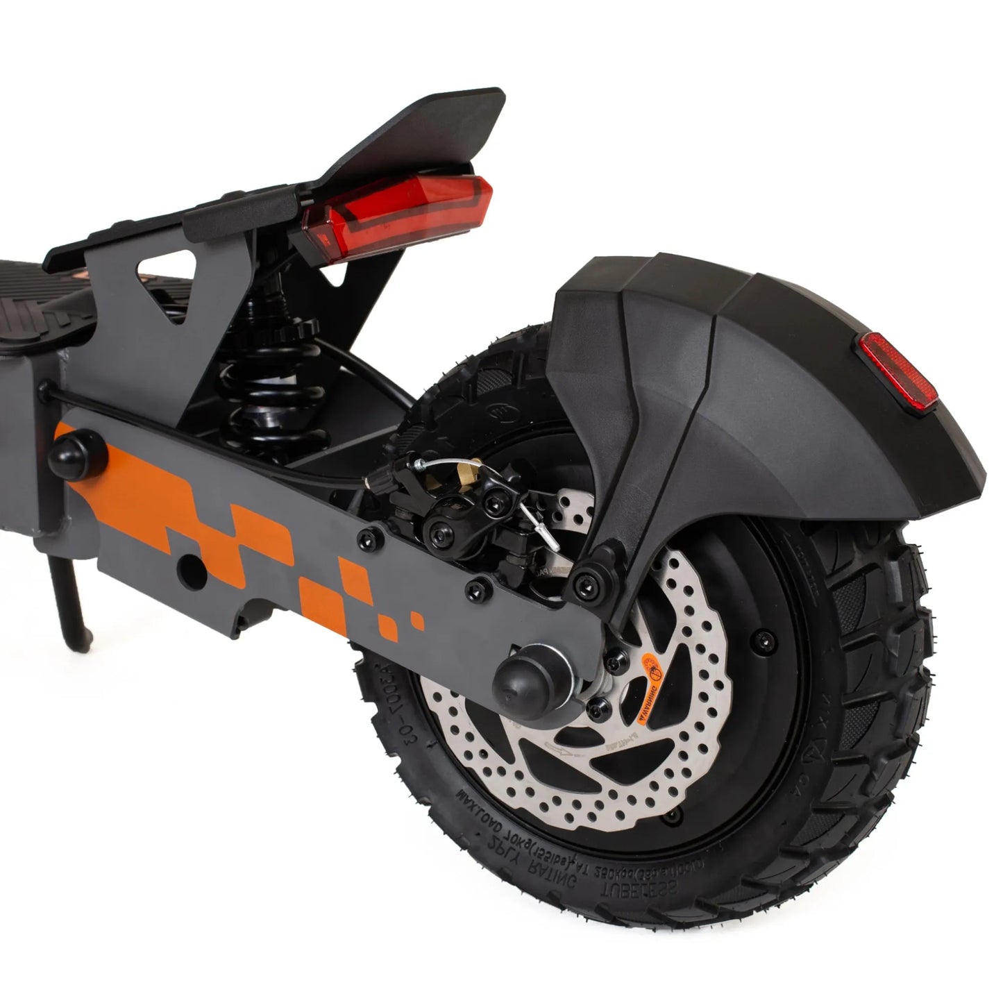 The product pictured is an Electric Scooter KuKirin G2. The image shows the rear of the scooter, featuring the taillights, suspension, and rear wheel. The wheel has a robust tread, indicating good grip, while the scooter's frame is designed with grey and orange elements.