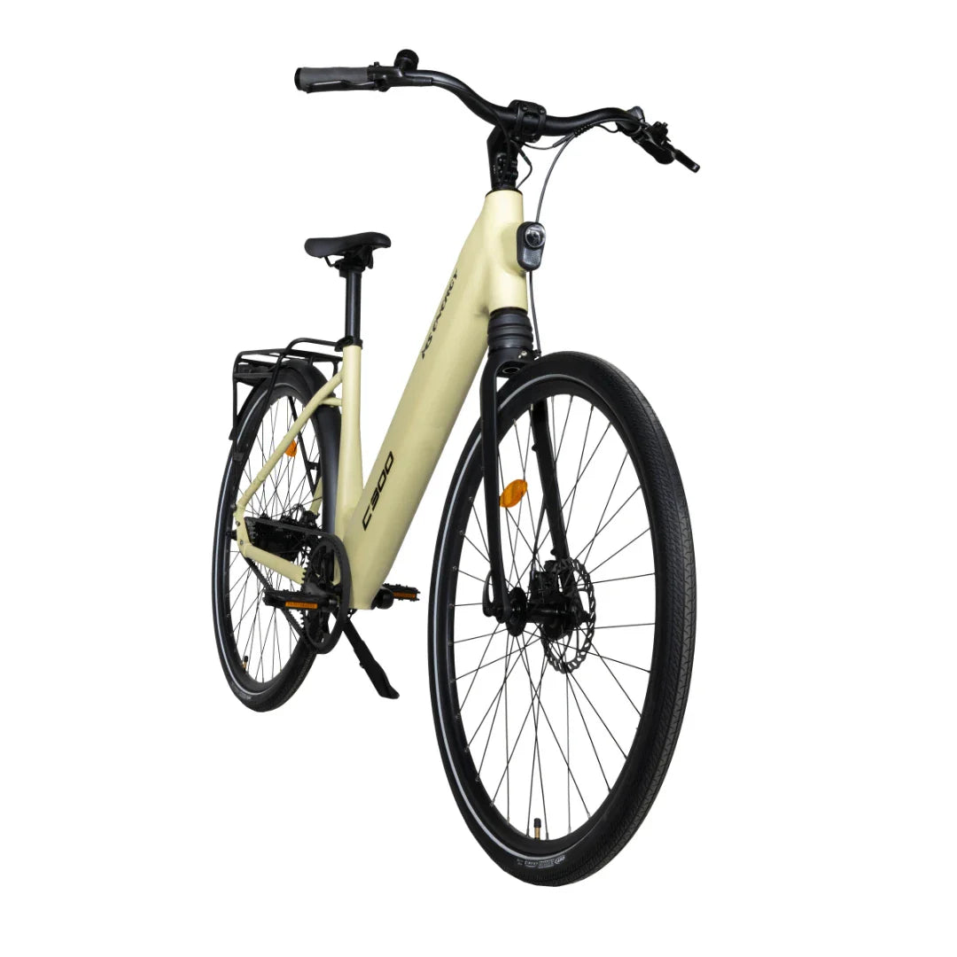 The product is an Electric bike, brand MS Energy, model C300. The image shows the bike in a light beige color, featuring a comfortable frame, wide tires, and disc brakes. The bike is equipped with a luggage rack and ergonomic handles, suggesting a comfortable ride.