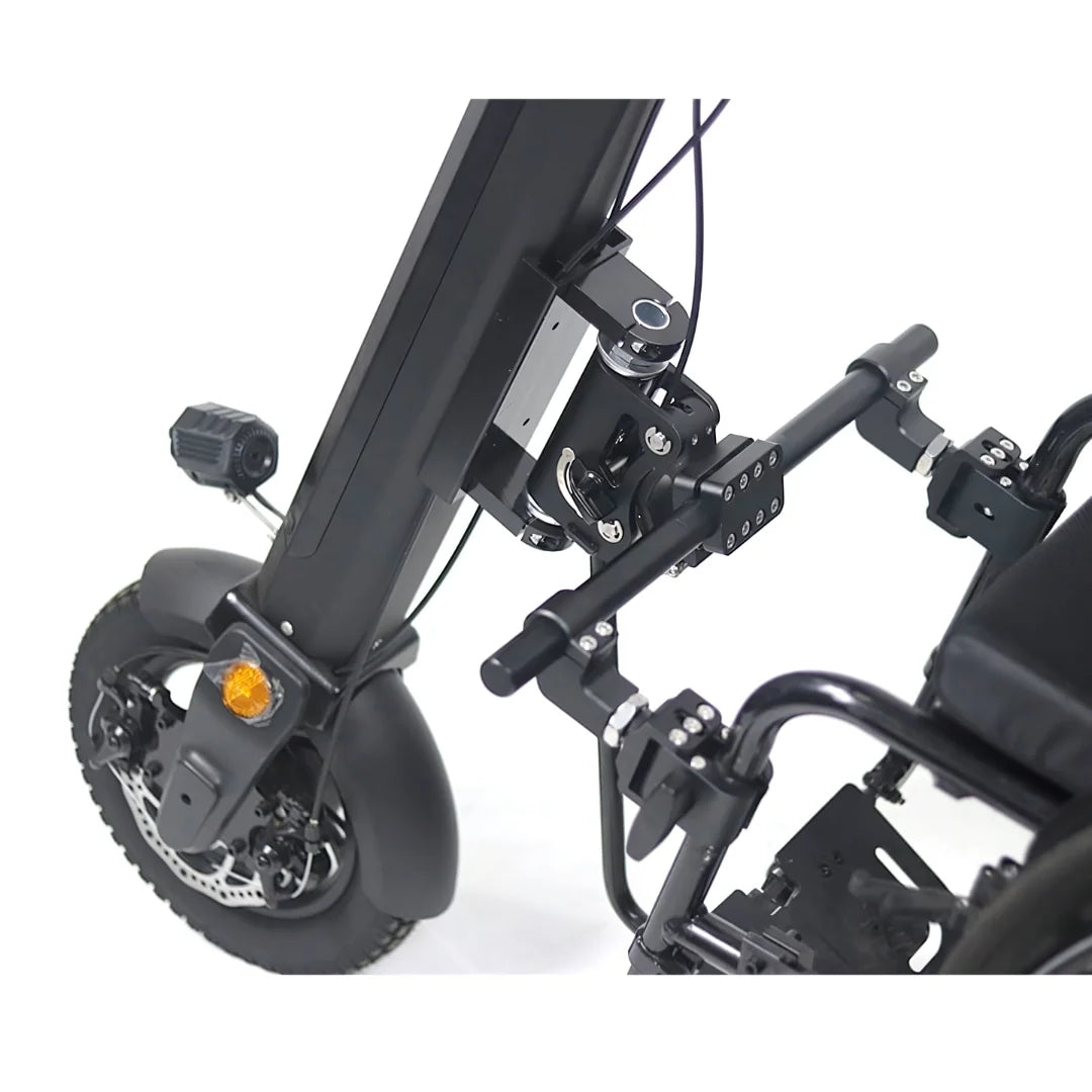 The product shown is an electric attachment for wheelchairs, model Mijo MT01. The image displays the structure of the attachment, which includes the part for connecting to the wheelchair and wheels with brakes. Some mechanisms for adjustment and stability are also shown. The overall design is engineered for ease of use and mobility.