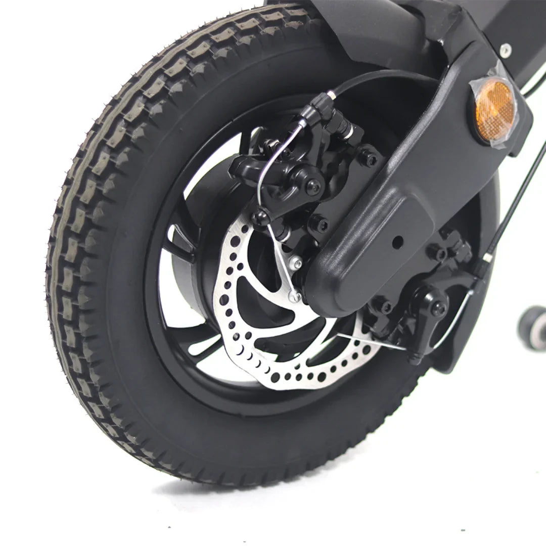 The product in the image is an electric scooter, model Mijo MT01. The rear tire, which has a robust tread, and the disc brake are visible, indicating good braking performance. The scooter also features connecting and stabilizing elements, contributing to its functionality and safety.