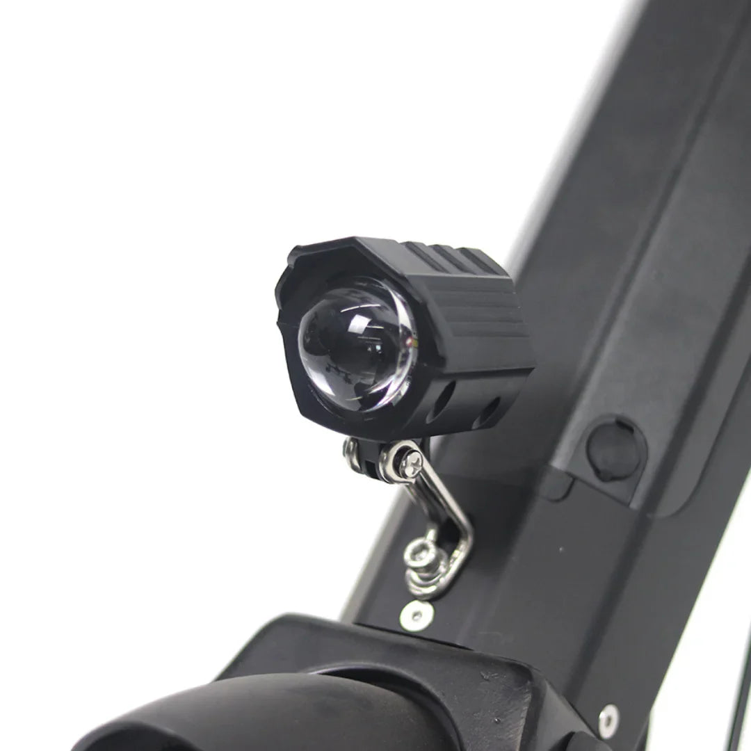 The product is an electric attachment, model Mijo MT01. The image shows a part of an electric scooter with an attached light, designed to improve visibility while riding. The light is black and is mounted on the scooter's frame, indicating its functionality and practicality for night riding.