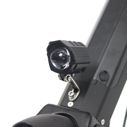 The product is an electric attachment, model Mijo MT01. The image shows a part of an electric scooter with an attached light, designed to improve visibility while riding. The light is black and is mounted on the scooter's frame, indicating its functionality and practicality for night riding.