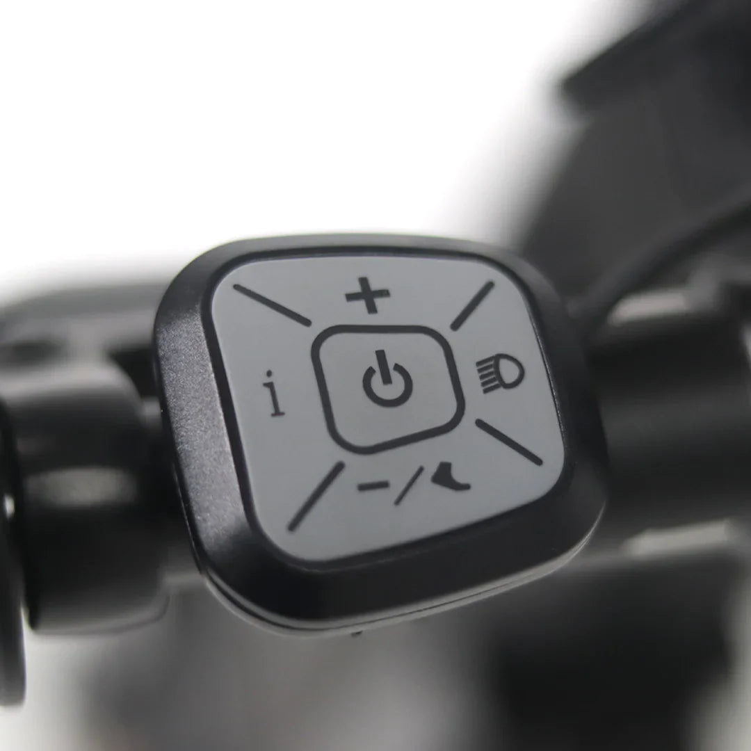 The image shows a part of the Mijo MT01 electric scooter. A control unit with three buttons is visible, including a power button, speed increase and decrease buttons, and a light button. The control unit is designed for easy operation of the scooter's functions.